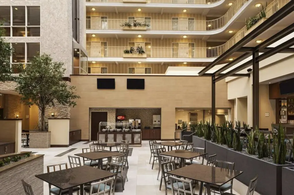 Embassy Suites Dallas Market Center courtyard and restaurant free breakfast