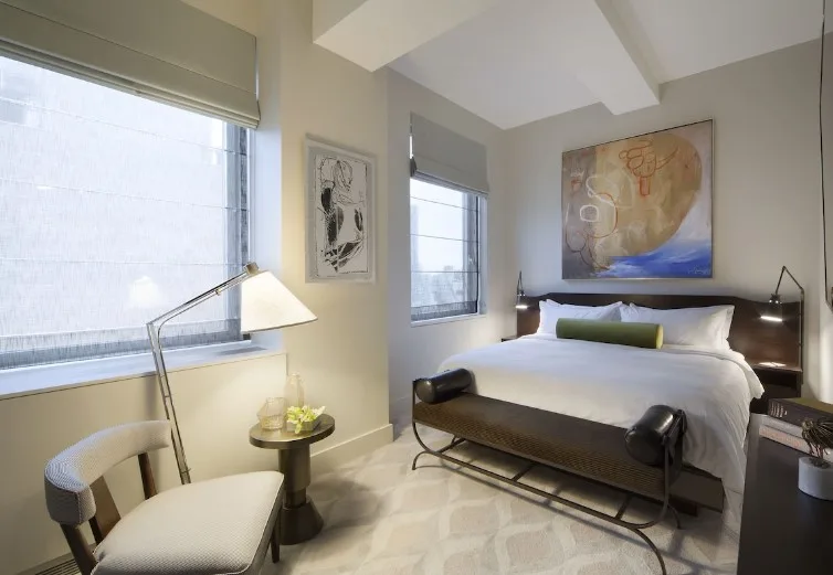 Bedroom of The Marmara Park Avenue, a hotel in NYC with an indoor pool.
