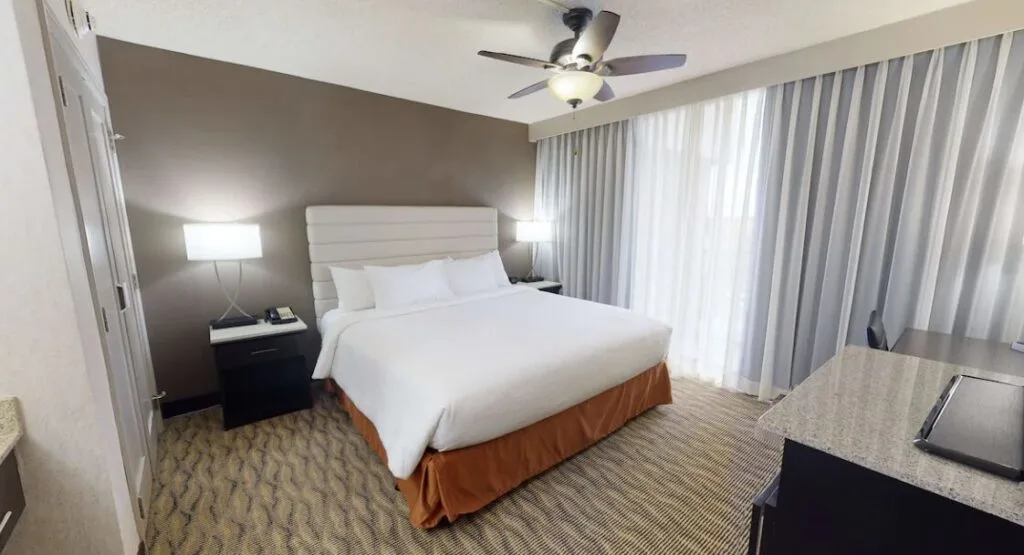 modern hotel room interior at Embassy Suites by Hilton Will Rogers Airport