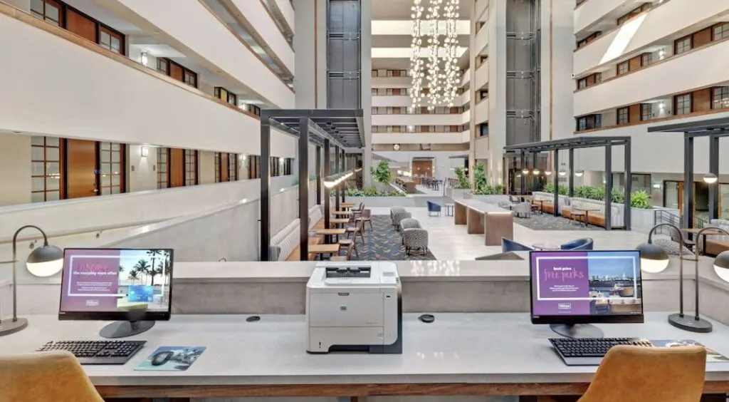 large hotel lobby at Embassy Suites by Hilton Will Rogers Airport