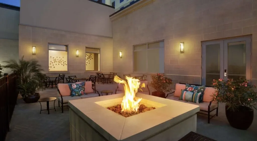 outdoor terrace with fireplace at Embassy Suites by Hilton Oklahoma City Downtown Medical Center