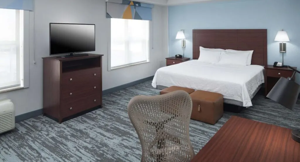 spacious hotel room interior at Hampton Inn & Suites Oklahoma City-Bricktown