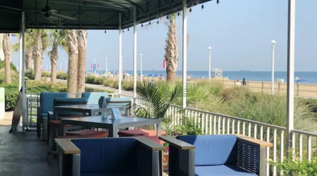 Virginia Beach hotel outdoor terrace with comfortable seating and beach view at Holiday Inn Beach/Oceanside (21st St), an IHG Hotel