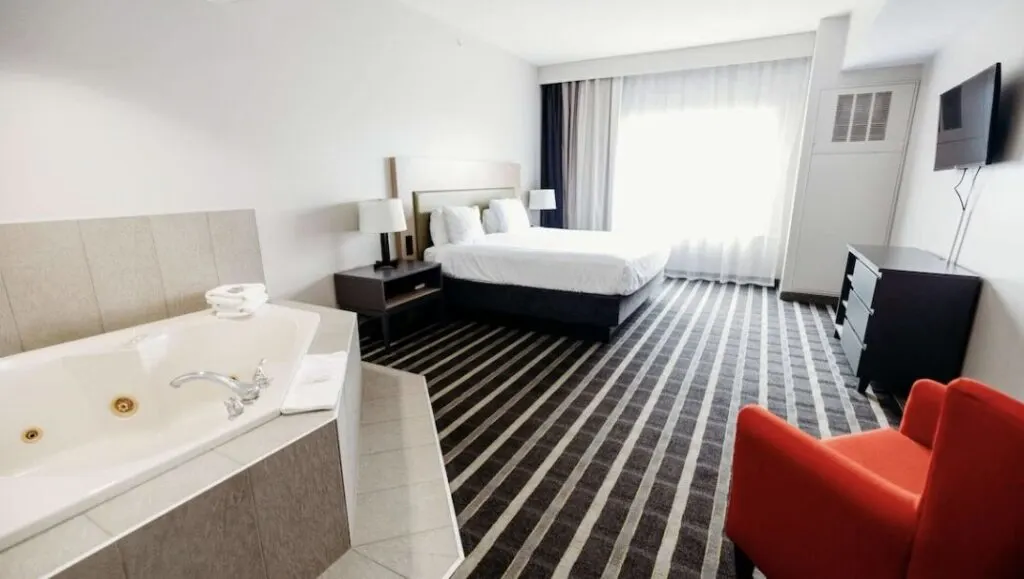 spacious hotel room at Country Inn & Suites by Radisson Lancaster with indoor jacuzzi hot tub