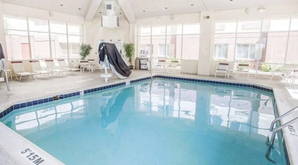 indoor hotel pool in Denver CO with large windows at Quality Inn & Suites Denver International Airport 
