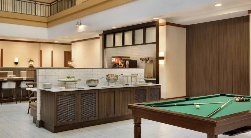 breakfast area with pool table at Embassy Suites by Hilton Denver International Airport Colorado