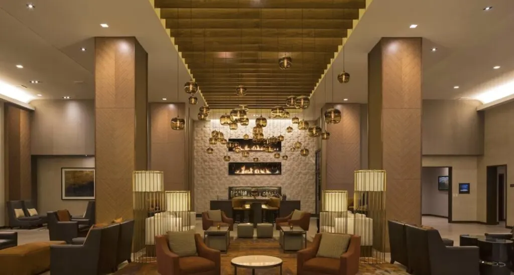 huge luxurious lobby at Grand Hyatt Denver hotel with indoor pool